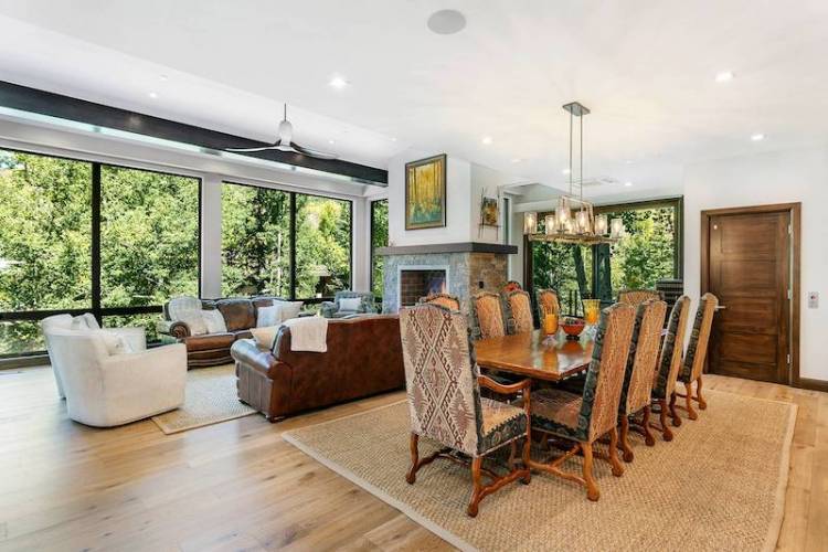 A dining room and living room in a Vail vacation rental