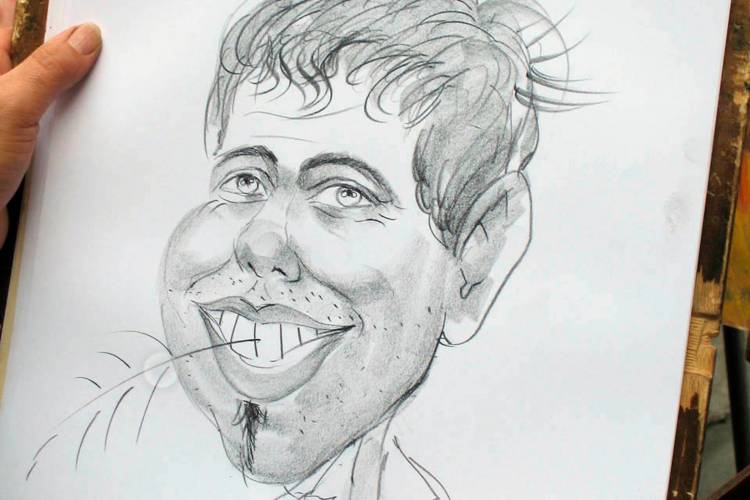 Cartoonist making a caricature of a man.