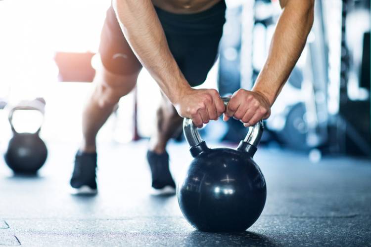 A man using a weight in the gym