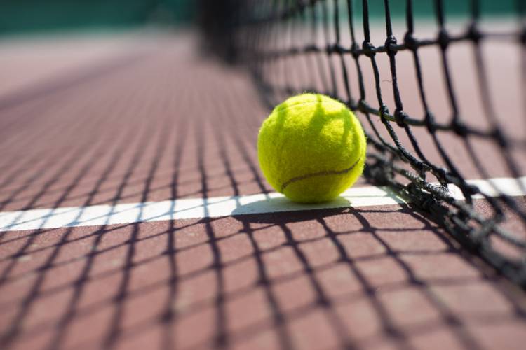 A tennis ball on a court