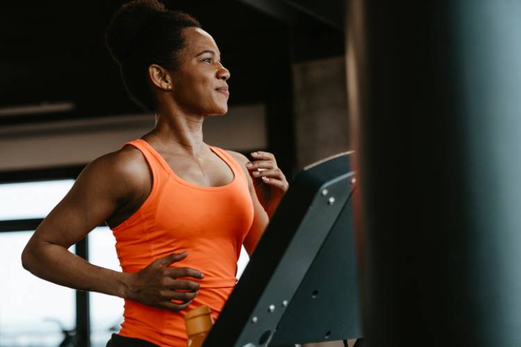 A woman works out on a treadmill
